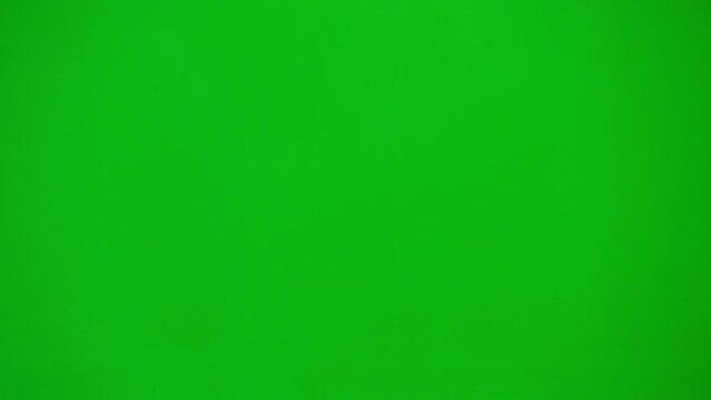 Portrait Of Man Medic On Chroma Key Green Screen. Close Up Side Profile Senior Doctor In Uniform Walking Talking On Smartphone.