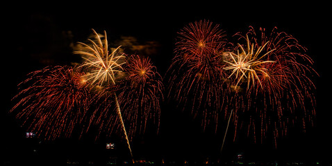 Fireworks show under defocus or blur concepts with isolated black background at night, this...