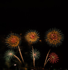 Fireworks show under defocus or blur concepts with isolated black background at night, this...