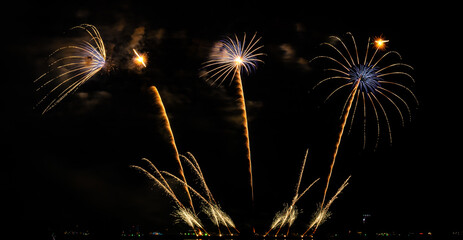 Fireworks show under defocus or blur concepts with isolated black background at night, this...