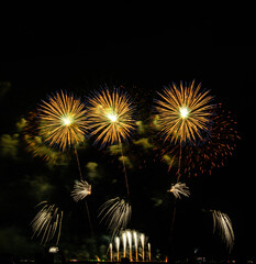 Fireworks show under defocus or blur concepts with isolated black background at night, this...