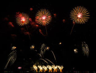 Fireworks show under defocus or blur concepts with isolated black background at night, this...