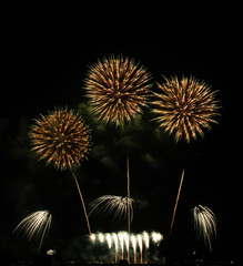 Fireworks show under defocus or blur concepts with isolated black background at night, this...