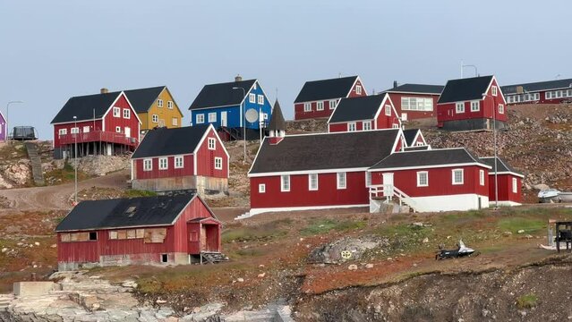 Houses of Ittoqqortoormiit in a slightly foggy morning. Scoresbysund, Greenland.