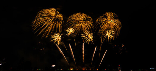 Fireworks show under defocus or blur concepts with isolated black background at night, this...