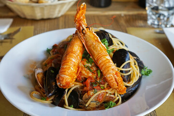 Close up dish of Scampi shrimp and fresh mussel spaghetti seafood pasta