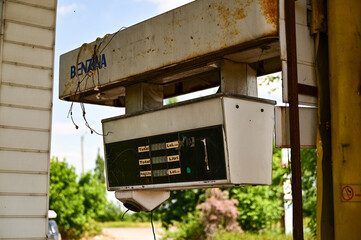Old run-down gas station with gas pumps as a lost place in Wallachia in Romania