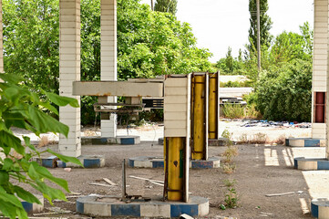 Old run-down gas station with gas pumps as a lost place in Wallachia in Romania