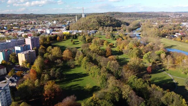 Autumnal Trees Along Ostravice River In Komenskeho Sady Grove Park In Ostrava, Czech Republic.Scenic view of majestic.