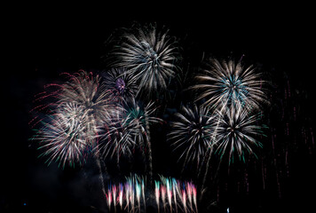 Fireworks show under defocus or blur concepts with isolated black background at night, this celebration is for the International Fireworks Festival in Pattaya on Nov 24-25 in Thailand