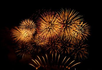 Fireworks show under defocus or blur concepts with isolated black background at night, this...