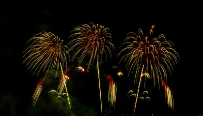 Fireworks show under defocus or blur concepts with isolated black background at night, this...
