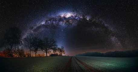Fototapeten Starry night with milky way over nature. © luchschenF