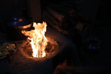 a traditional stove buring the fire in a Gurung village in Ghandruk town for keep warming. Gandaki...