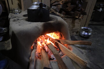 a traditional stove buring the fire in a Gurung village in Ghandruk town for keep warming. Gandaki...
