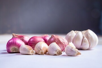 Composition of red onions, garlic and various spices isolated on white background, top view