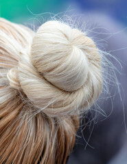 Close-up of collected hair on a blonde woman's head
