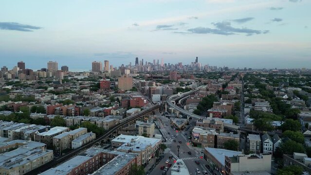 North Chicago city aerial with Subway and car traffic sunset evening light descending drone downtown clark street establishing shot
