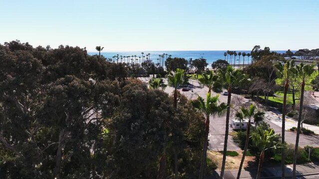 Parking Lot At Doheny State Beach On A Sunny Day In California, USA. - aerial ascend shot