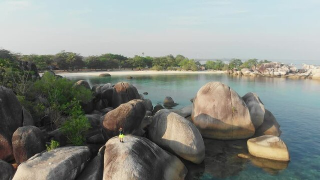 Reveal shot of big granite boulders at Belitung Island Indonesia, aerial
