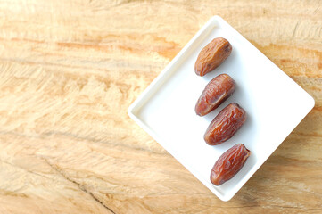 Sweet Dates on Wooden Background. Ramadan and Eid Mubarak Special Traditional Middle East Arab Traditional Dates for Iftar.