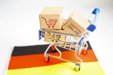 Online shopping, Shopping cart box on Germany flag, import export, finance commerce.