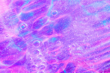 Beautiful neon purple, pink and blue transparent space alien glitter slime background texture. Sparkle cosmic, surreal abstract backdrop, ethereal, liquid art gel galaxy substance.