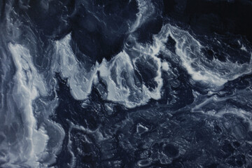 Marble dark blue background. Texture of stone slab. Graphic abstract background.Ceramic countertop.Porcelain stoneware is dark blue.