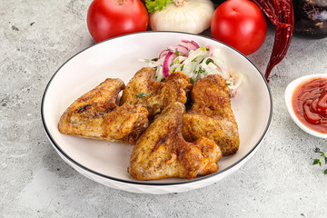 Grilled chicken wings with sauce