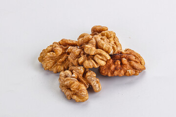 Cracked kernel walnut heap isolated