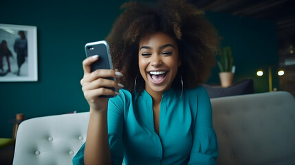 Excited happy young black woman holding smart phone device sitting on sofa at home - Happy satisfied female looking at mobile smartphone screen gesturing yes with clenched fist - Techn. generative ai. - obrazy, fototapety, plakaty