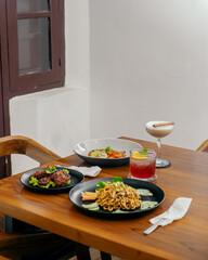 dinner table with healthy food and beverages. 