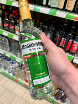 Moskovskaya Vodka Bottle Held in Hand at the Liquor Store