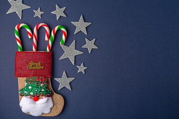 Christmas card on blue background , Christmas stars and Christmas candy. Christmas holiday.