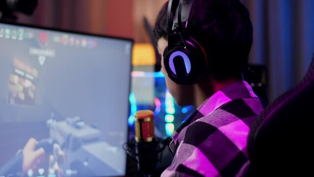 Asian Boy Streamer Celebrating Winning Game On Computer.  Live Stream Video Game
