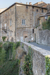 Fototapeta na wymiar old houses on town ramparts, Volterra, Italy