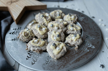 Almond macaroons with poppy seeds and white chocolate. Christmas cookies 
