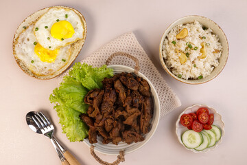 Beef Tapa, Tapsilog  is Filipino Traditional Beef Dish, Served with Egg and Garlic Fried Rice.