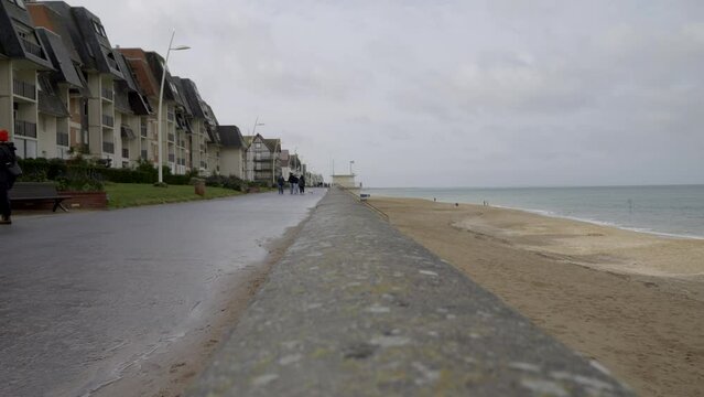 Normandy, France. 11-01-2023. people walk on the seafront. Cabourg city. Super Slow motion 4K