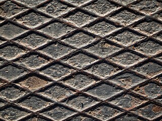 Rusty old weathered diamond plate texture close up top down view