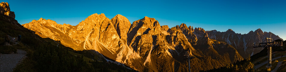 High resolution stitched alpine summer sunrise panorama at Mount Kreuzjoch, Fulpmes, Stubaital...