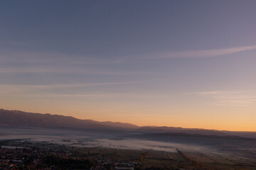 aerial view of foggy morning autumn mountains with clouds bansko bulgaria