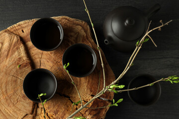 The concept of Asian tea, on a dark background with plants.