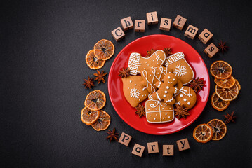 Christmas party inscription with wooden cubes on a dark concrete background