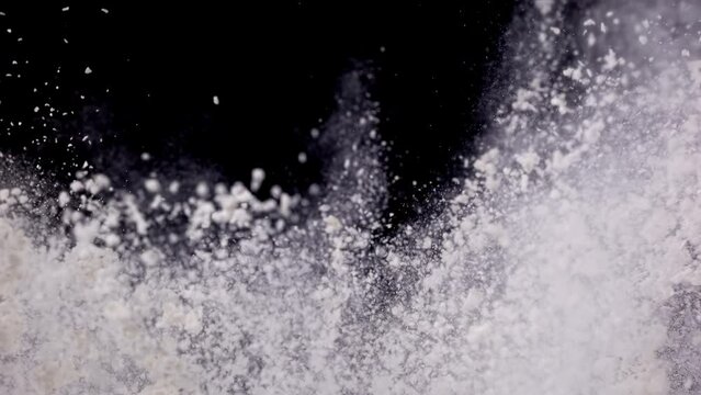 Flour explodes closeup in super slow motion 1000fps