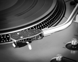 Old dusty vinyl turntable player isolated over white background.