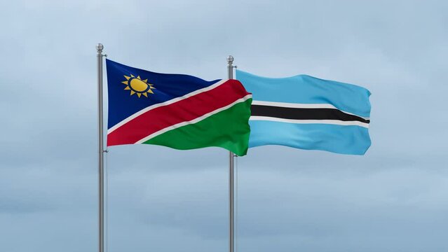 Botswana flag and Namibia flag waving together on cloudy sky, endless seamless loop, two country relations concept