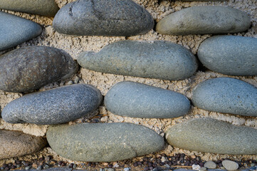 sea ​​pebbles with concrete as background 2