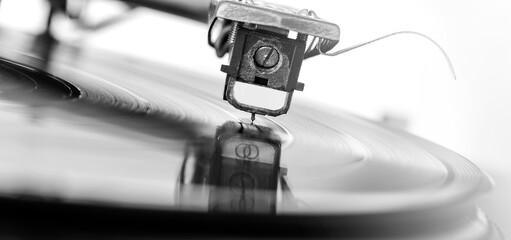 Old dusty vinyl turntable player isolated over white background.