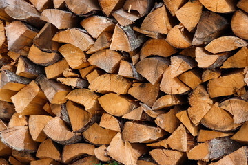 Background of chopped stacked firewood pile